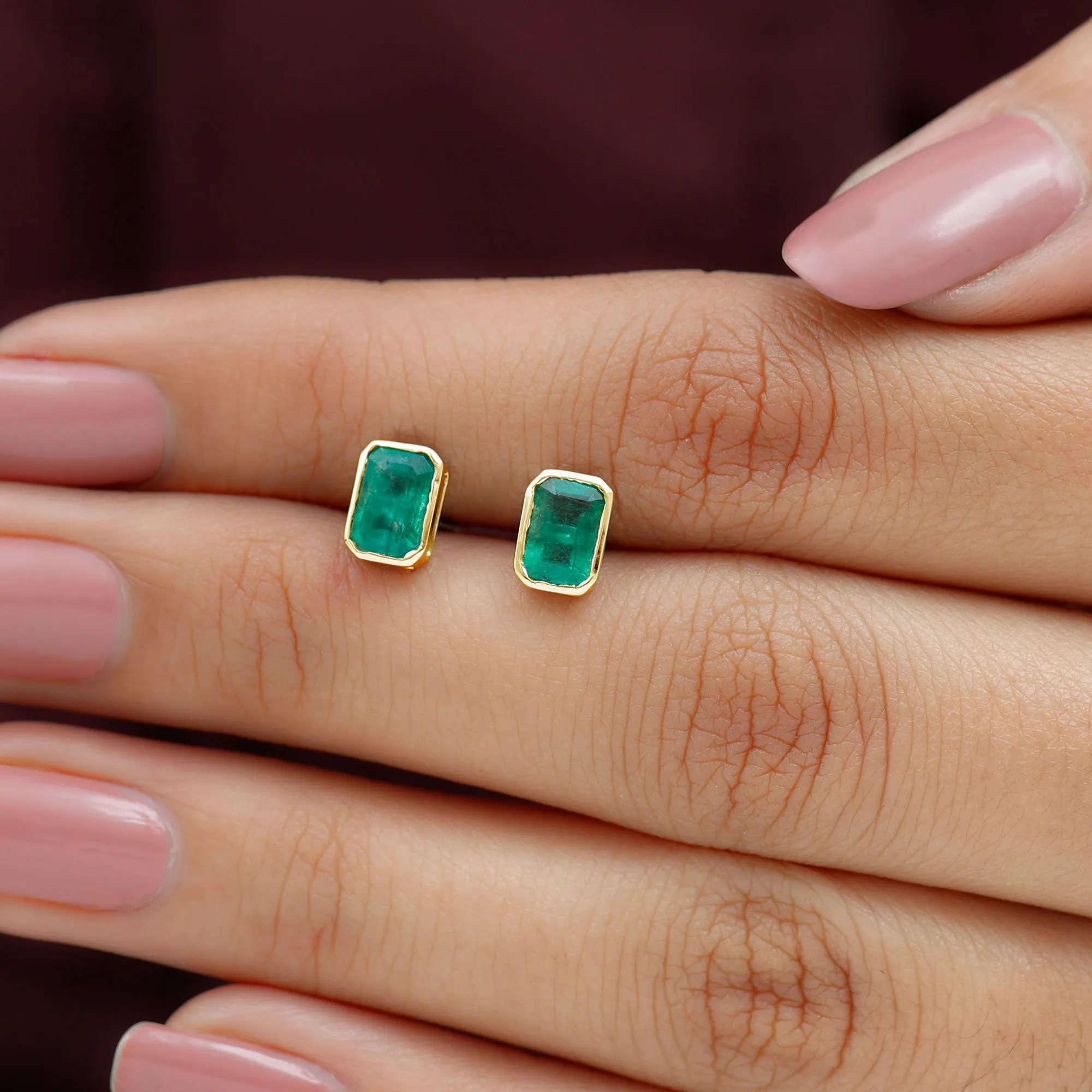 Octagon Cut Emerald Solitaire Stud Earrings in Bezel Setting