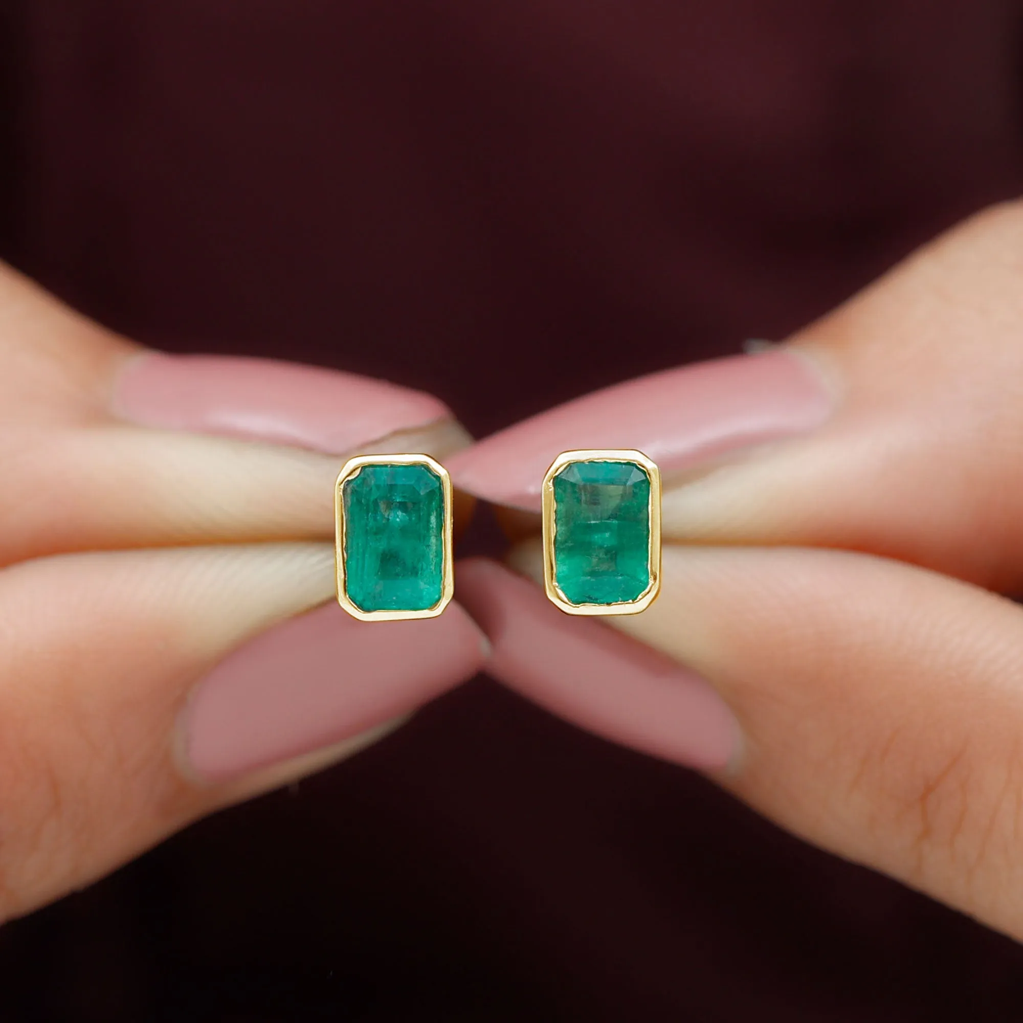 Octagon Cut Emerald Solitaire Stud Earrings in Bezel Setting