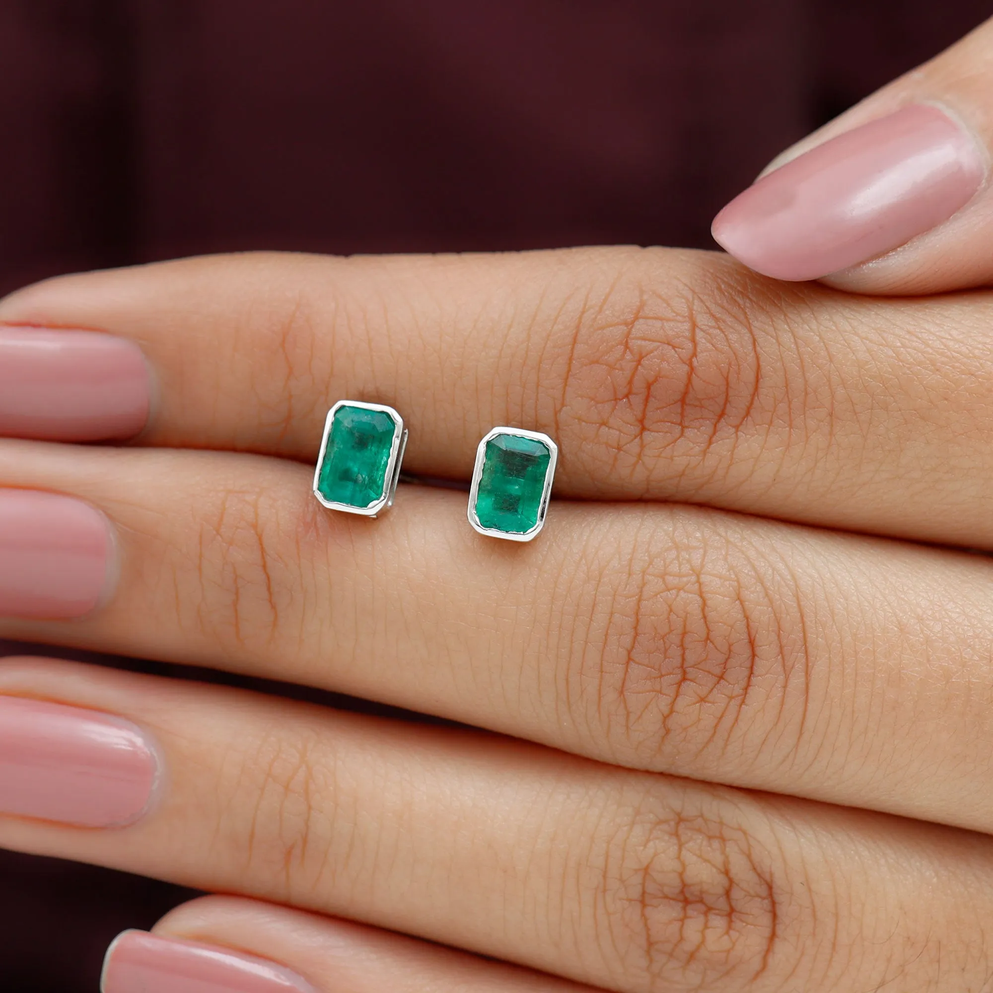 Octagon Cut Emerald Solitaire Stud Earrings in Bezel Setting